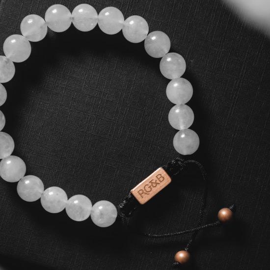 White Jade Bracelet - Our White Jade Bead Bracelet Features Natural Stones, Waxed Cord and Brushed Rose Gold Steel Hardware. A Beautiful Addition to any Collection.